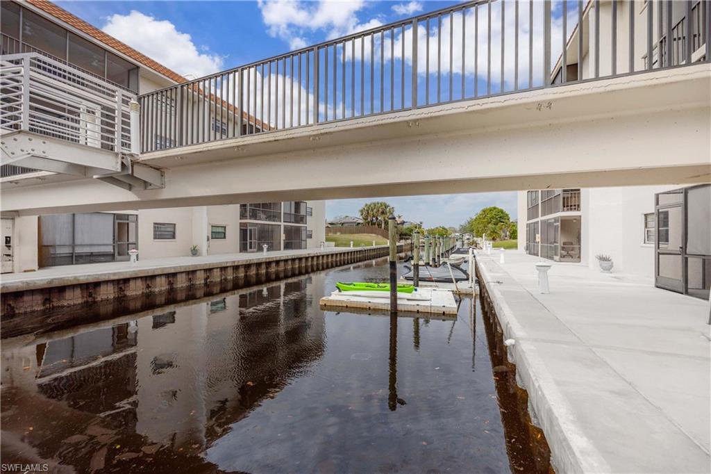 9395 Pennsylvania Avenue, Unit 3 Bonita Springs, FL 34135 - Photo 34 of 42 View of swimming pool with a water view