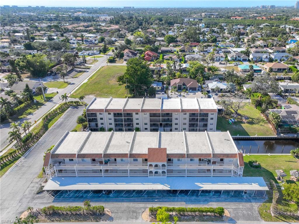 9395 Pennsylvania Avenue, Unit 3 Bonita Springs, FL 34135 - Photo 40 of 42 Drone / aerial view featuring a water view