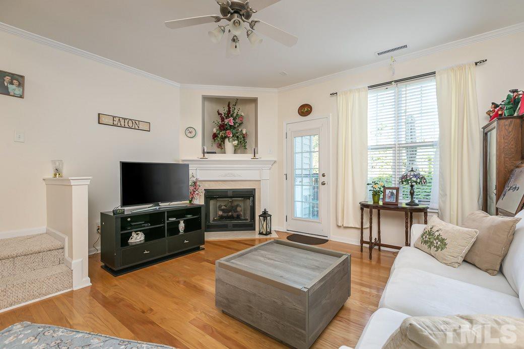 4834 Sir Duncan Way Raleigh, NC 27612 - Photo 11 of 27 Gas fireplace and media or decor nook above the mantle.