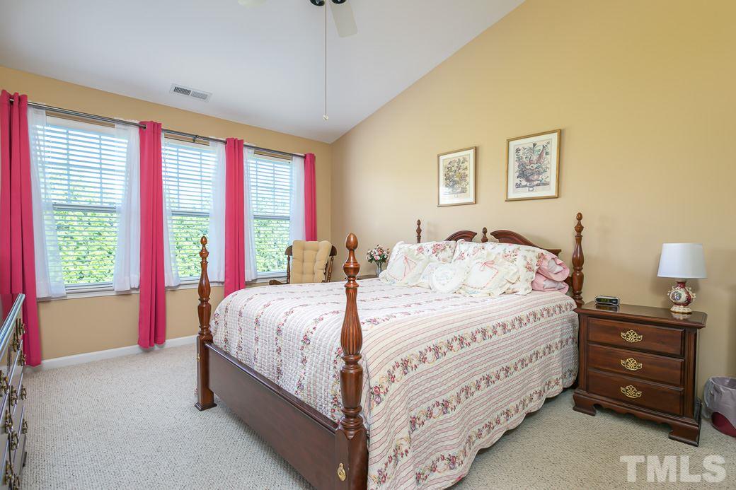 4834 Sir Duncan Way Raleigh, NC 27612 - Photo 13 of 27 Master suite with vaulted ceiling, carpet, and plenty of natural light!