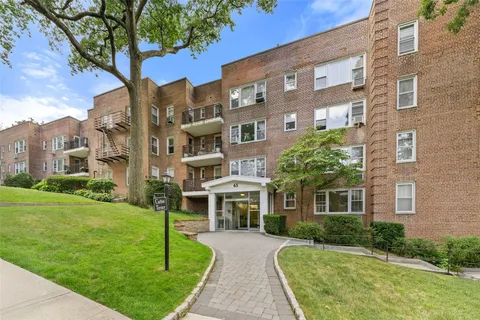 a front view of a building with garden