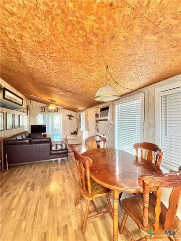 a living room with a couch and a chandelier