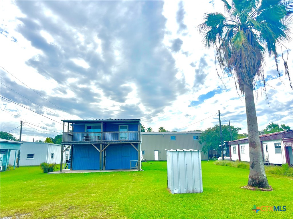 307 North 12th Port Port O'Connor, TX 77982 - Photo 2 of 45 a view of a house with a yard
