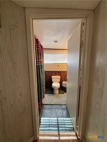 a bathroom with a toilet a sink and a bathtub