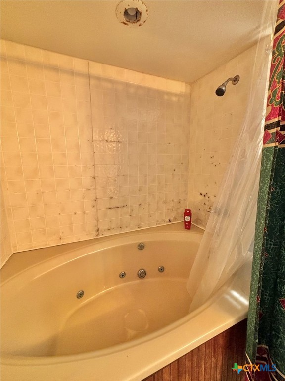 307 North 12th Port Port O'Connor, TX 77982 - Photo 32 of 45 a bathroom with a bathtub and shower