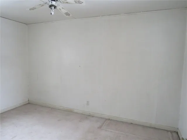 a room with a sink cabinets and utility room