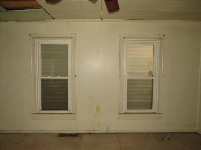 an empty room with windows