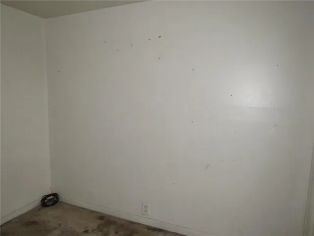 a bathroom with a shower and a toilet