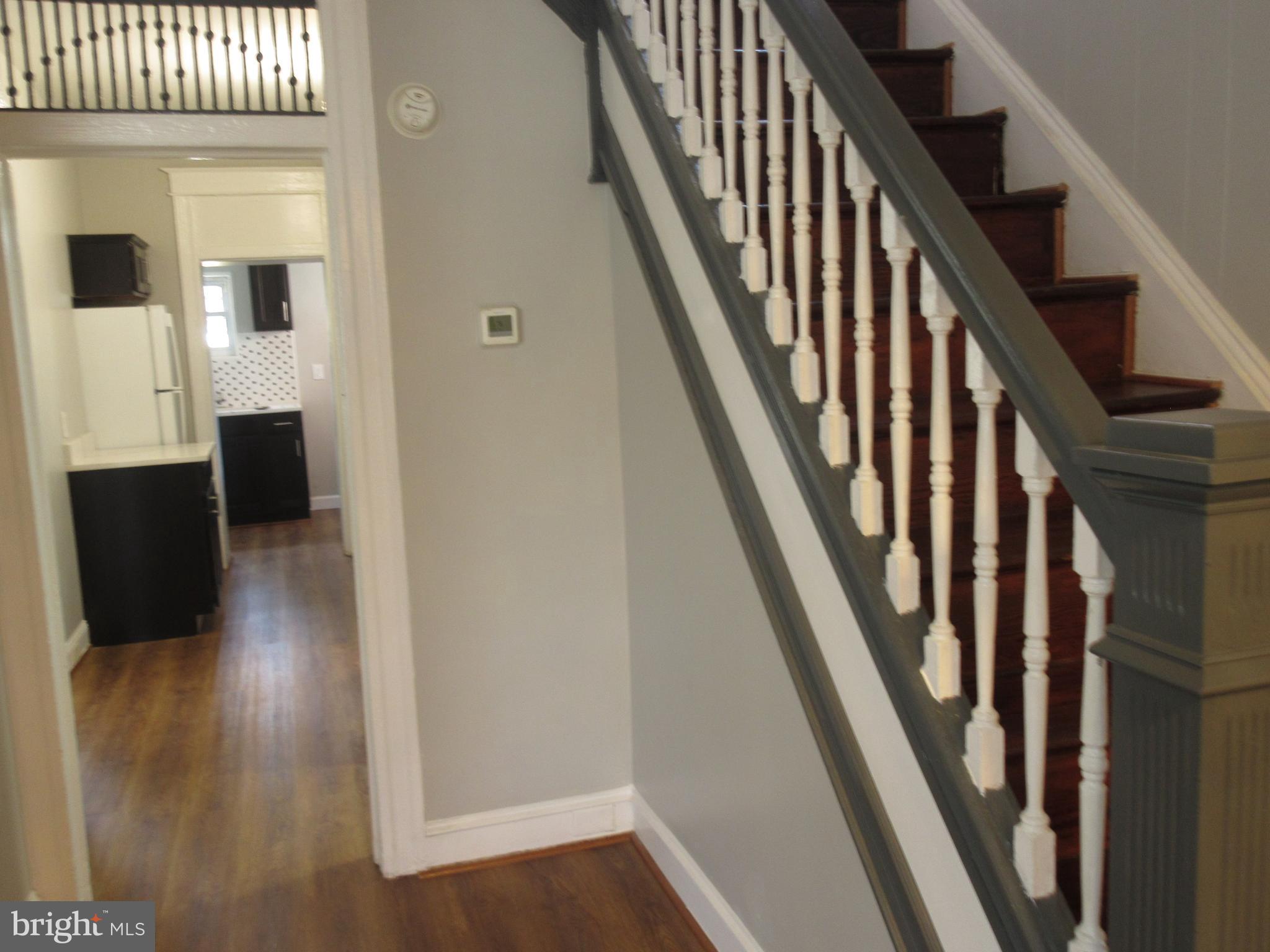 722 Edgewood Street Baltimore, MD 21229 - Photo 3 of 56 a view of entryway with wooden floor and stairs