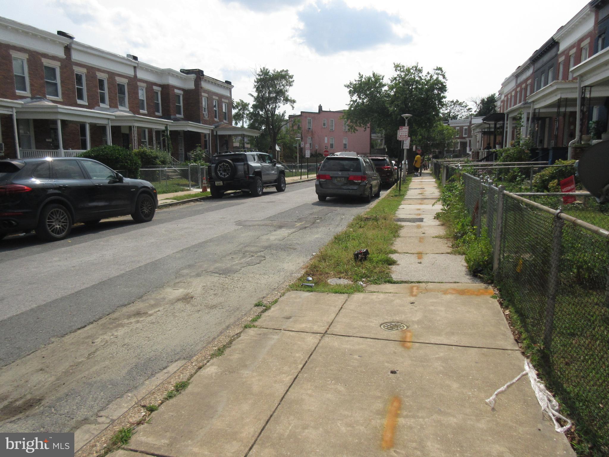 722 Edgewood Street Baltimore, MD 21229 - Photo 39 of 56 a view of street with parked cars