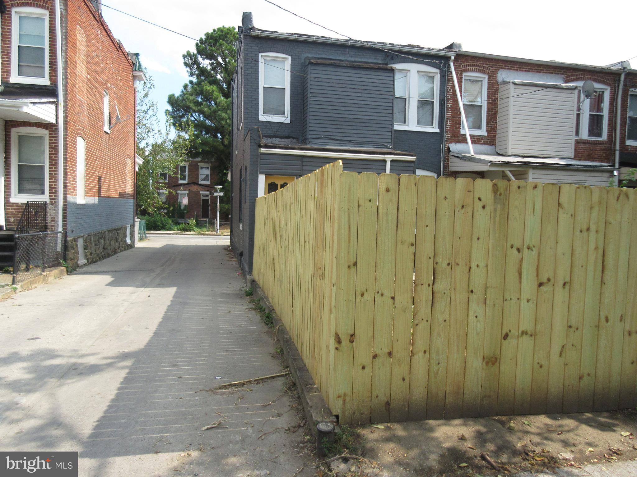 722 Edgewood Street Baltimore, MD 21229 - Photo 42 of 56 a view of a house with a wooden fence