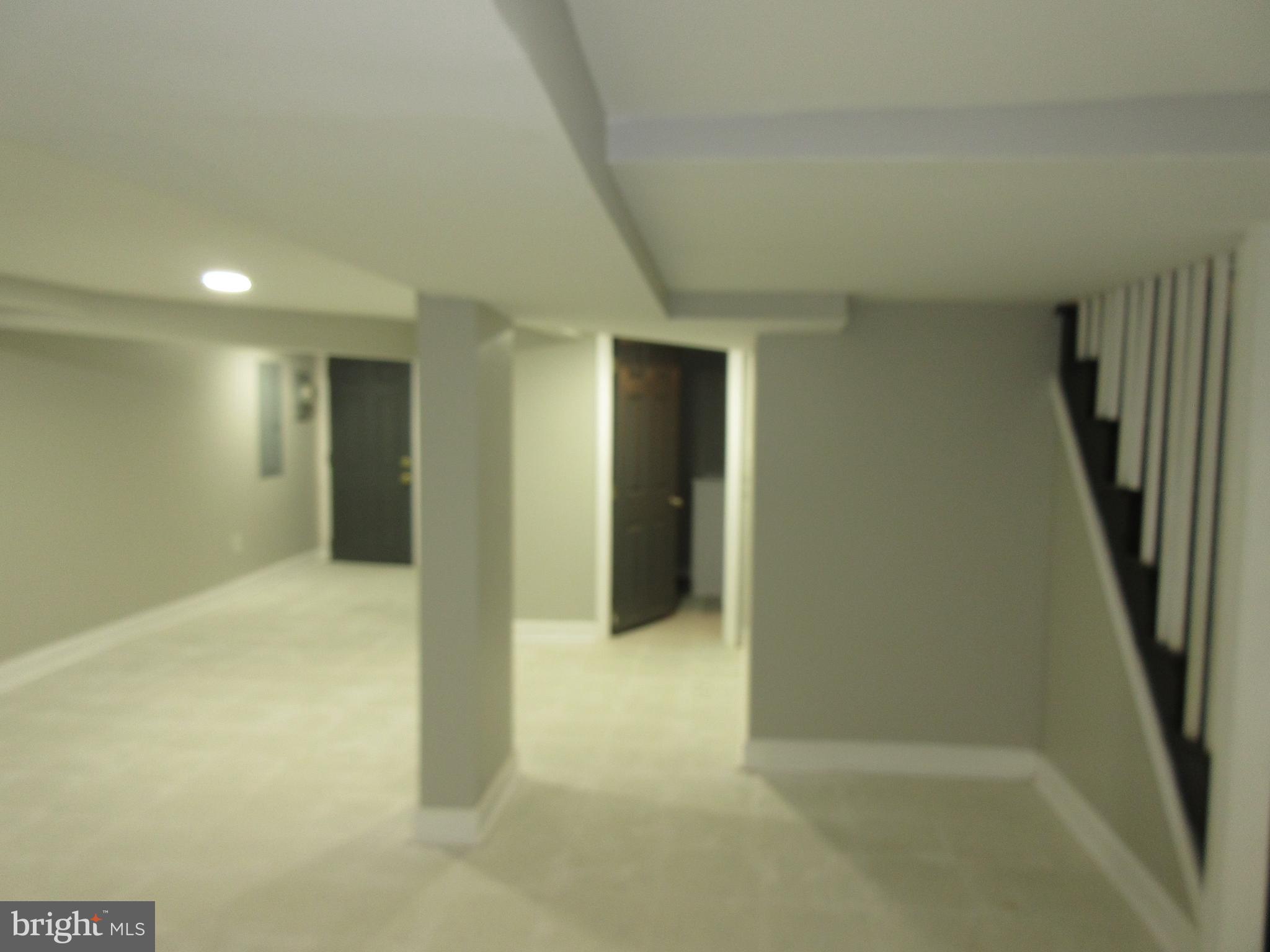 722 Edgewood Street Baltimore, MD 21229 - Photo 51 of 56 a view of an empty room with stairs