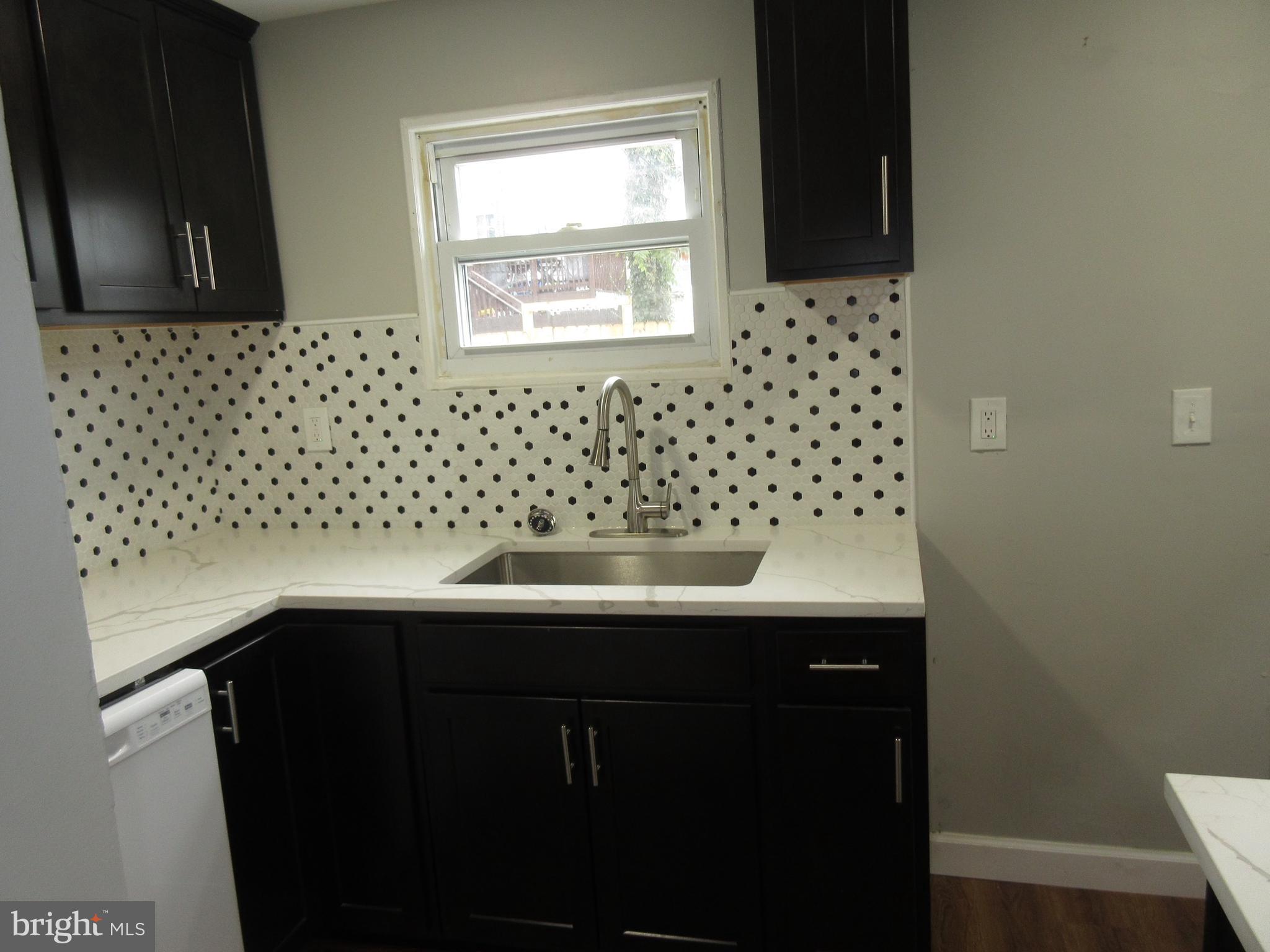 722 Edgewood Street Baltimore, MD 21229 - Photo 54 of 56 a view of a sink and a window
