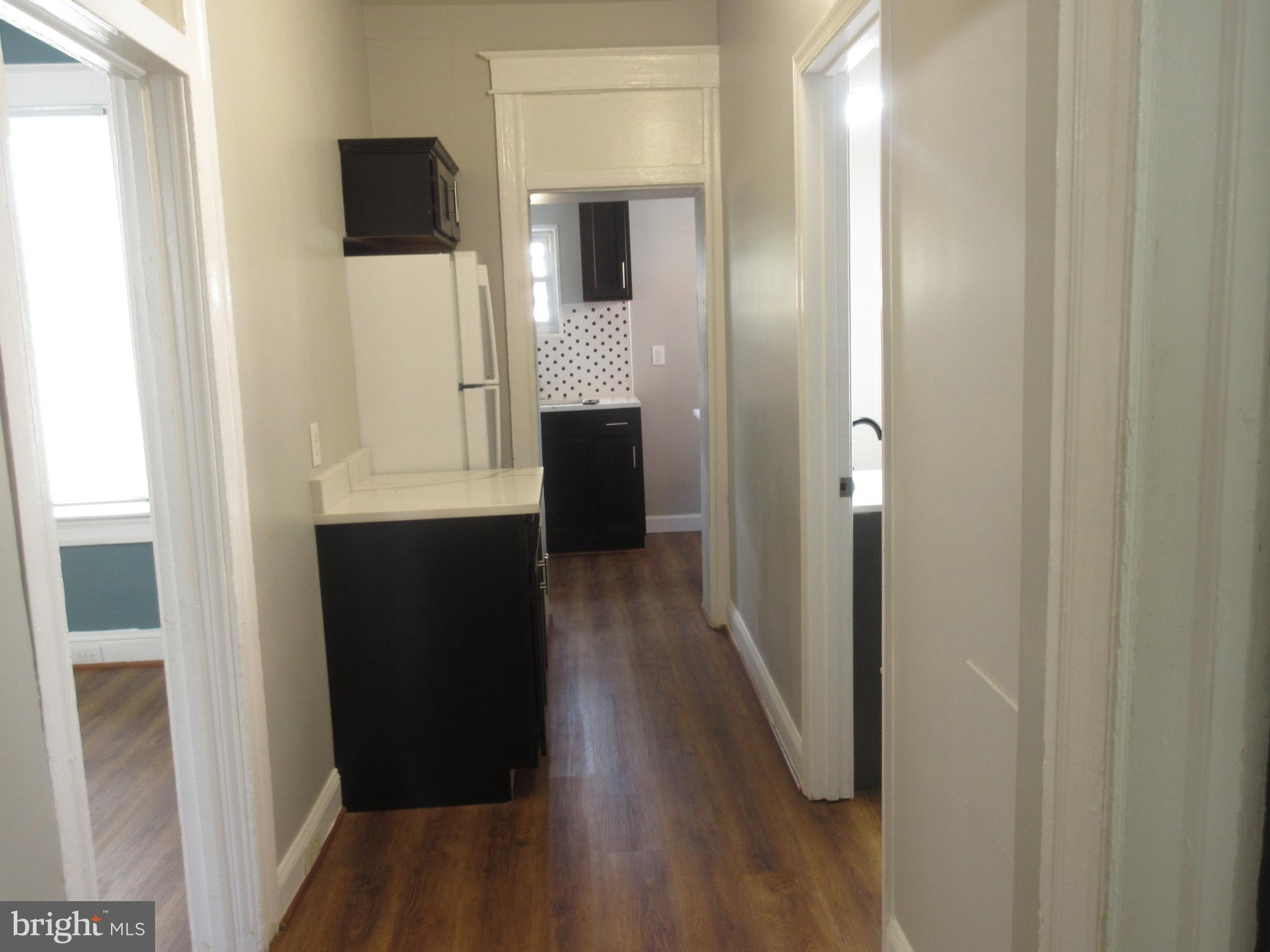 722 Edgewood Street Baltimore, MD 21229 - Photo 10 of 56 a view of hallway with wooden floor
