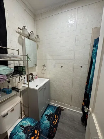 a roof deck with table and chairs