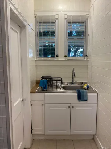 a kitchen with a sink and a stove top oven
