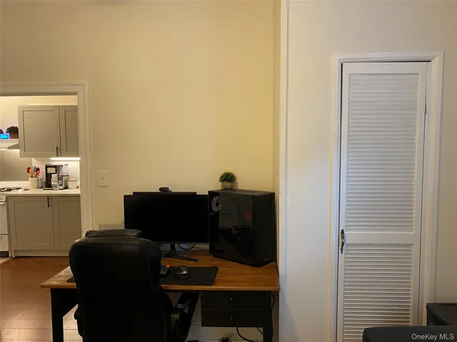a white toilet sitting next to a bathroom sink