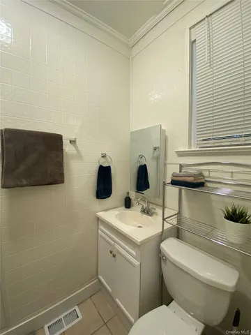 a bedroom with a bed and a closet