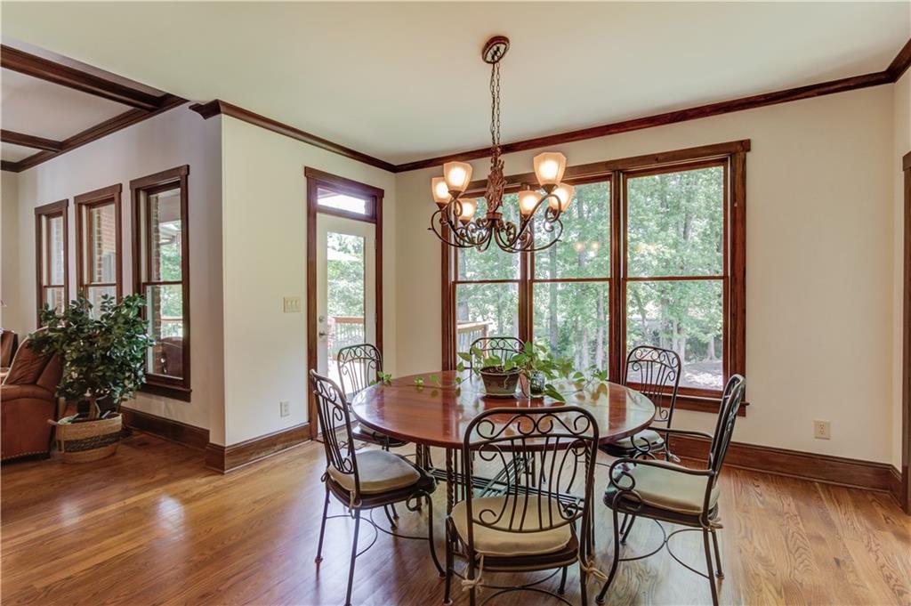 2240 Pear Grove Court Jefferson, GA 30549 - Photo 14 of 85 a view of a dining room with furniture window and wooden floor