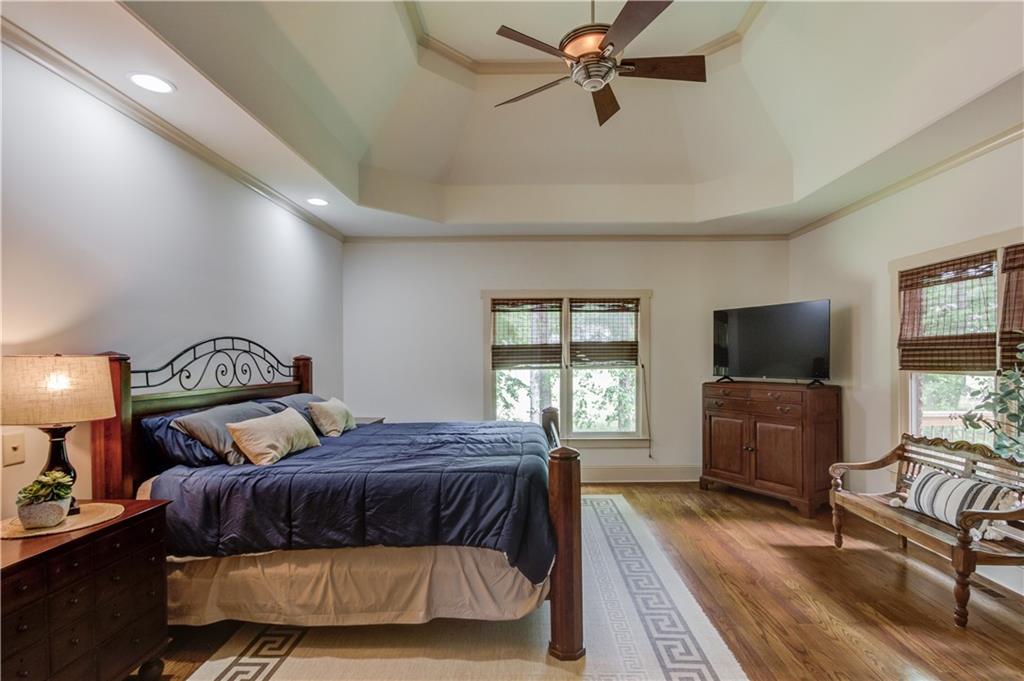 2240 Pear Grove Court Jefferson, GA 30549 - Photo 21 of 85 a bedroom with a bed and a flat screen tv