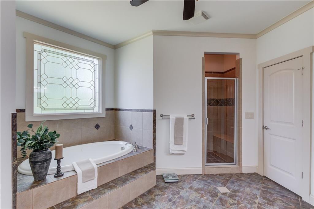 2240 Pear Grove Court Jefferson, GA 30549 - Photo 25 of 85 a bathroom with a tub shower and window