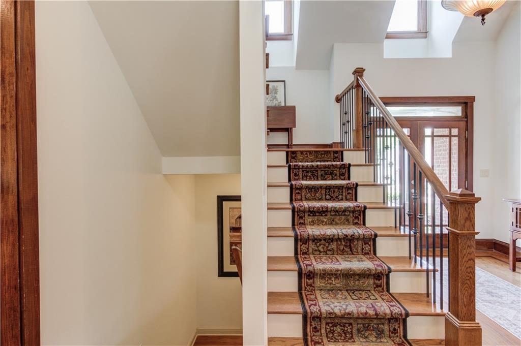 2240 Pear Grove Court Jefferson, GA 30549 - Photo 31 of 85 a view of staircase with wooden walls and stairs