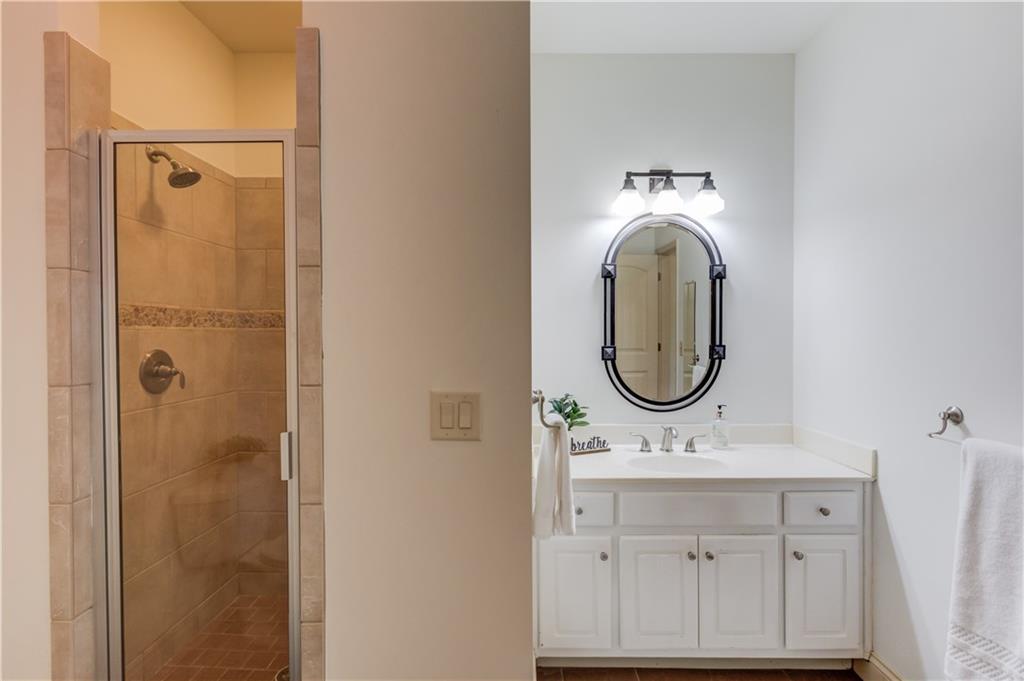 2240 Pear Grove Court Jefferson, GA 30549 - Photo 43 of 85 a bathroom with a sink mirror and shower