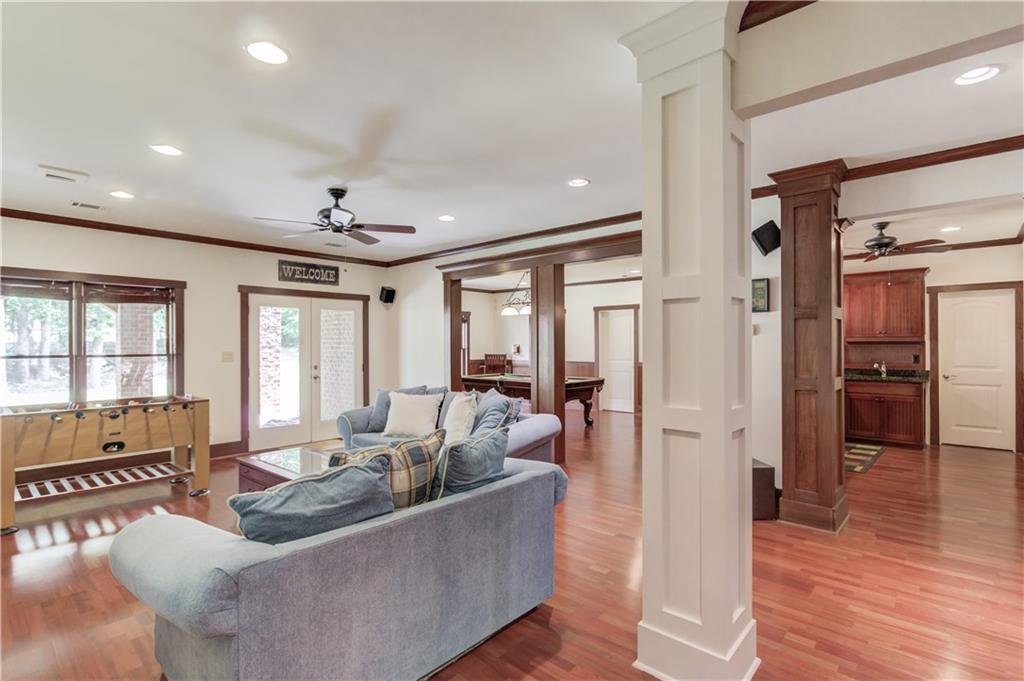 2240 Pear Grove Court Jefferson, GA 30549 - Photo 48 of 85 a living room with furniture and wooden floor