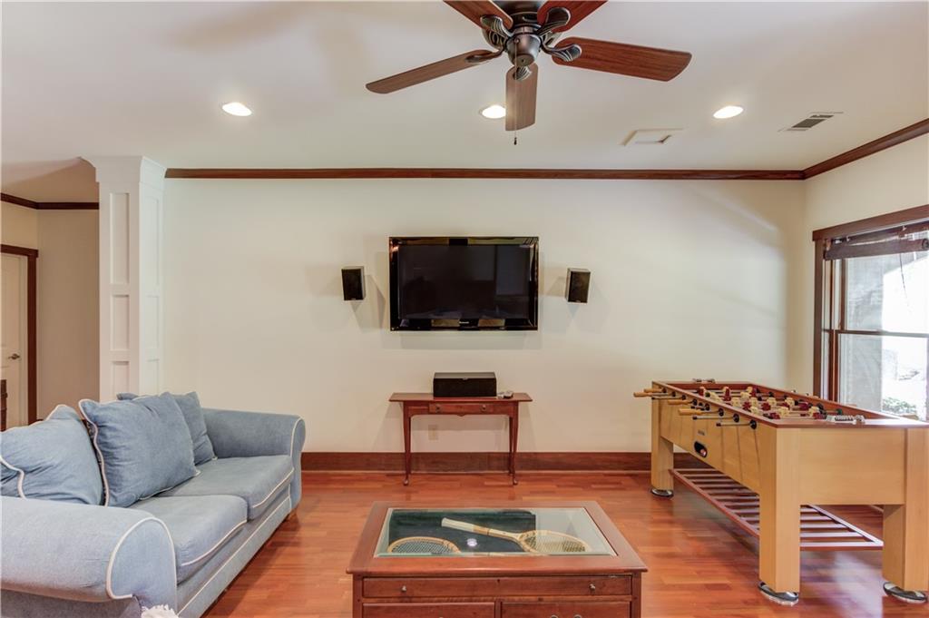 2240 Pear Grove Court Jefferson, GA 30549 - Photo 50 of 85 a living room with furniture and a flat screen tv