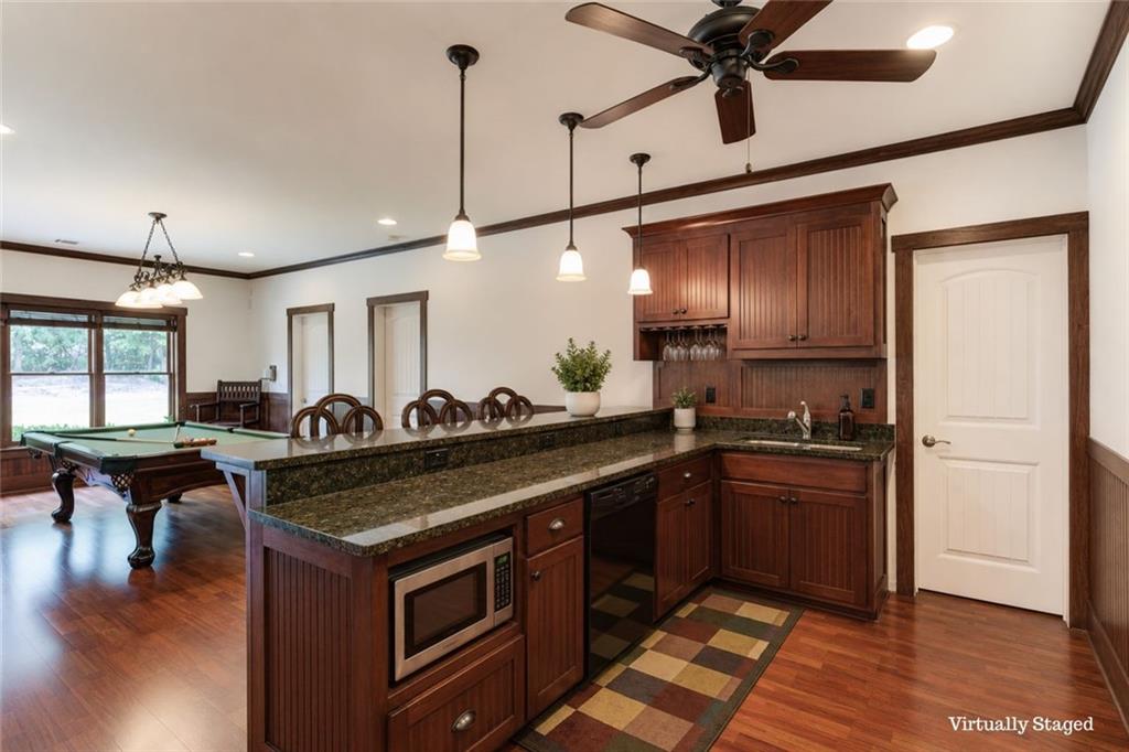 2240 Pear Grove Court Jefferson, GA 30549 - Photo 57 of 85 a kitchen with stainless steel appliances granite countertop a sink a stove and a refrigerator