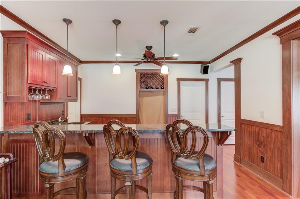 2240 Pear Grove Court Jefferson, GA 30549 - Photo 58 of 85 a view of a dining room with furniture window and wooden floor