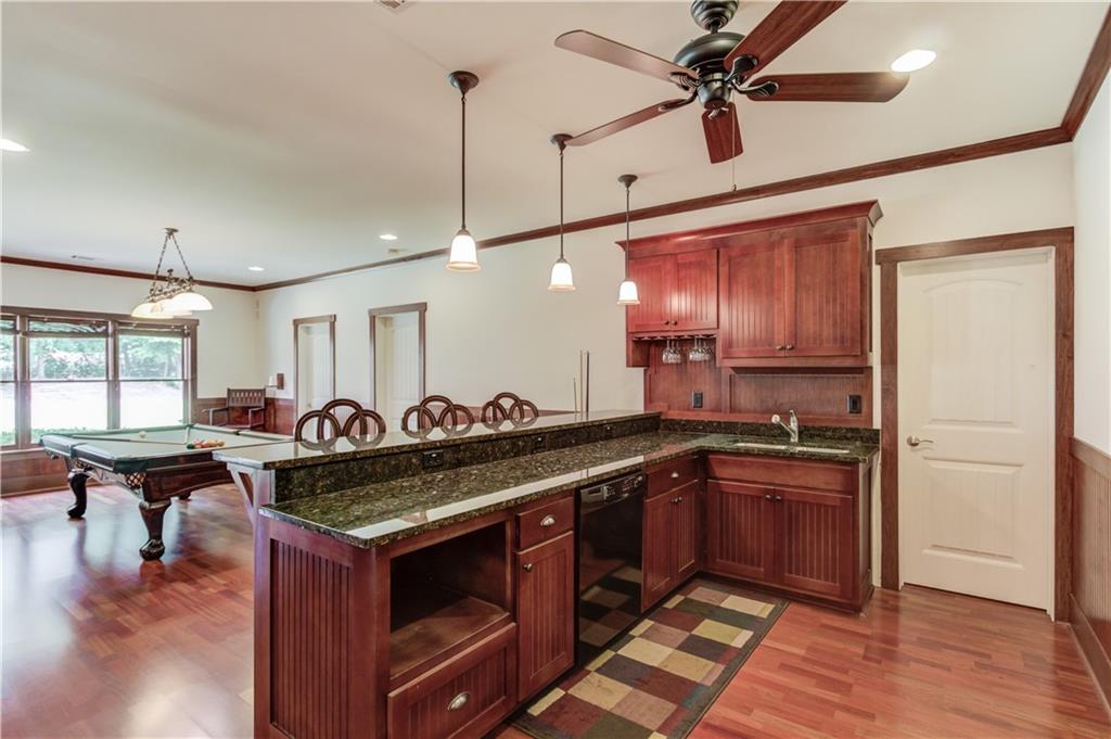2240 Pear Grove Court Jefferson, GA 30549 - Photo 59 of 85 a kitchen with stainless steel appliances granite countertop a stove and a refrigerator