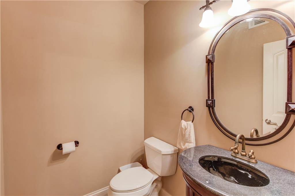 2240 Pear Grove Court Jefferson, GA 30549 - Photo 62 of 85 a bathroom with a sink and a mirror