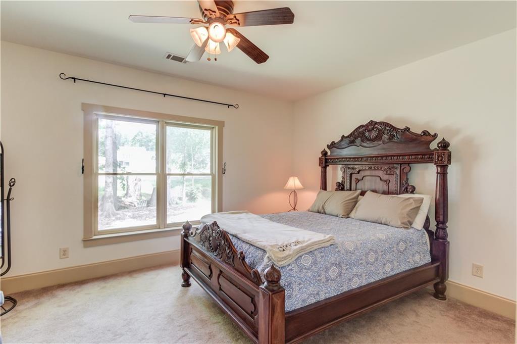 2240 Pear Grove Court Jefferson, GA 30549 - Photo 63 of 85 a bedroom with a bed next to a window