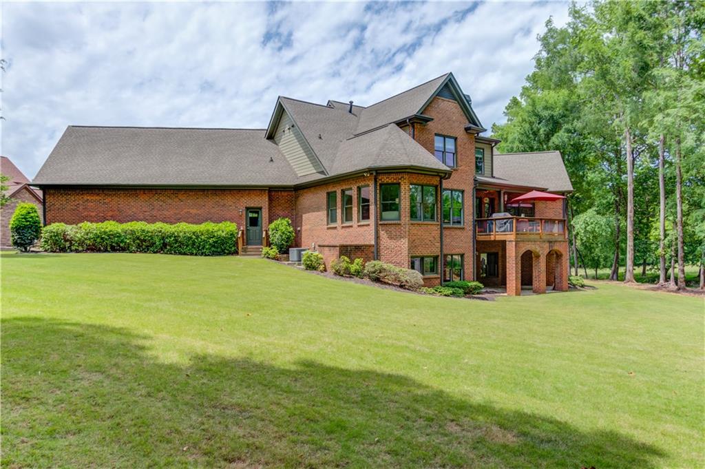 2240 Pear Grove Court Jefferson, GA 30549 - Photo 71 of 85 a view of a house with a big yard plants and large trees