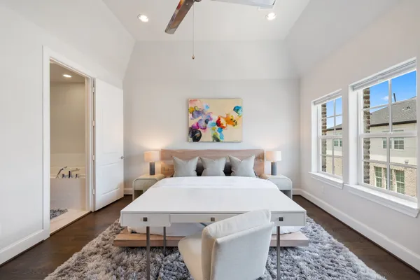 a bathroom with a tub a sink a double vanity