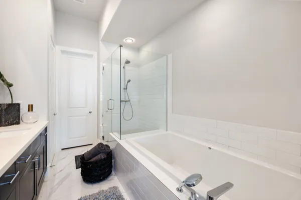 a bathroom with a glass shower door