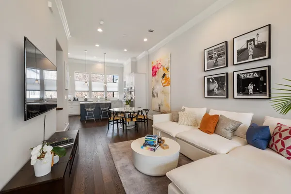 a living room with furniture and flat screen tv