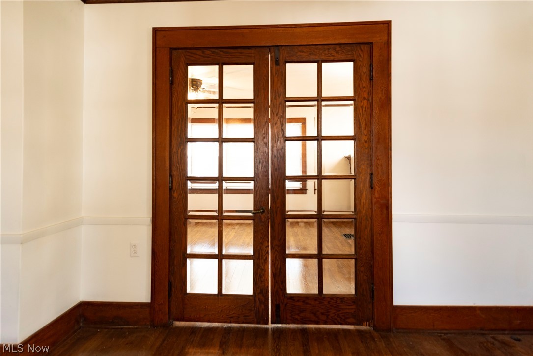 1022 North Howard Street Akron, OH 44310 - Photo 5 of 38 French doors to dining room with dark hardwood flooring.