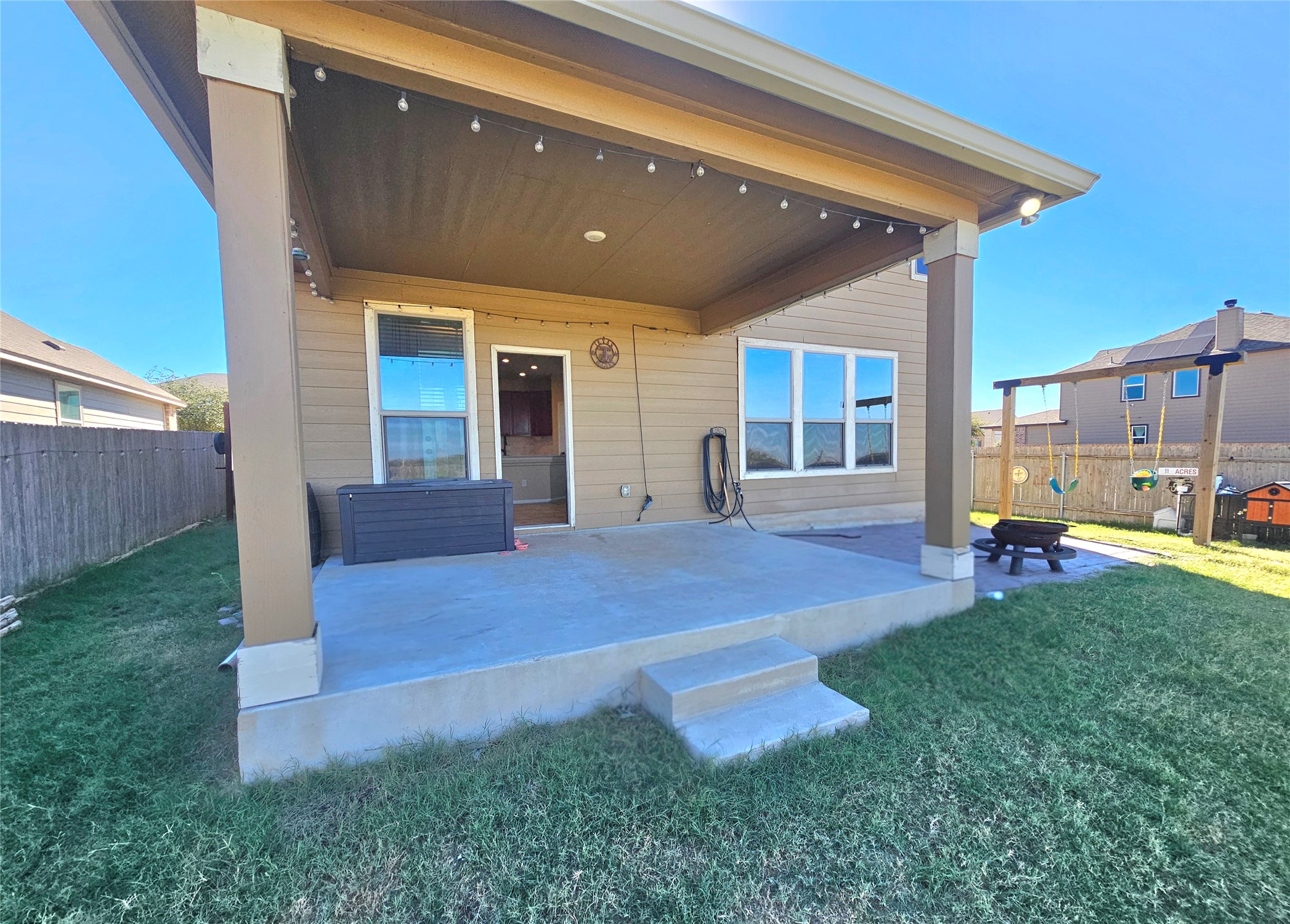 120 Schuylerville Drive Elgin, TX 78621 - Photo 23 of 29 Fenced backyard with a patio