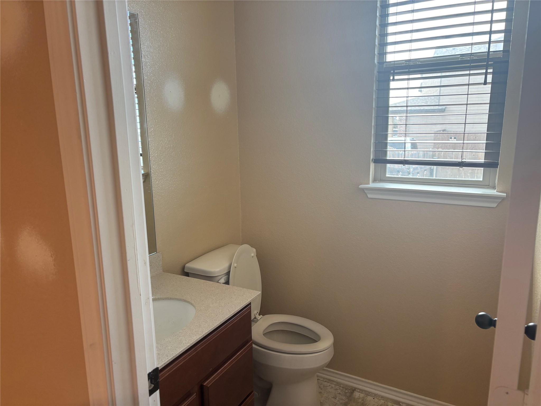 120 Schuylerville Drive Elgin, TX 78621 - Photo 5 of 29 Half bath featuring toilet and vanity