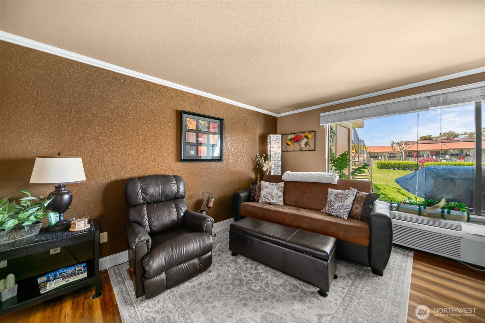 8903 Crescent Bar Road Northwest, Unit 101 Quincy, WA 98848 - Photo 16 of 40 a living room with furniture and a wooden floor