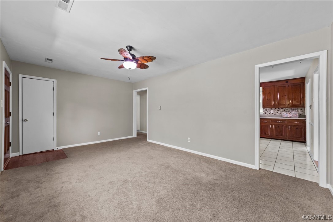 5525 Qualla Road Chesterfield, VA 23832 - Photo 16 of 50 a view of an empty room with a ceiling fan