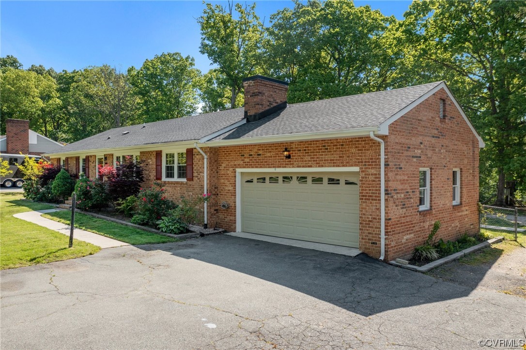 5525 Qualla Road Chesterfield, VA 23832 - Photo 4 of 50 a view of a house with a yard and garage