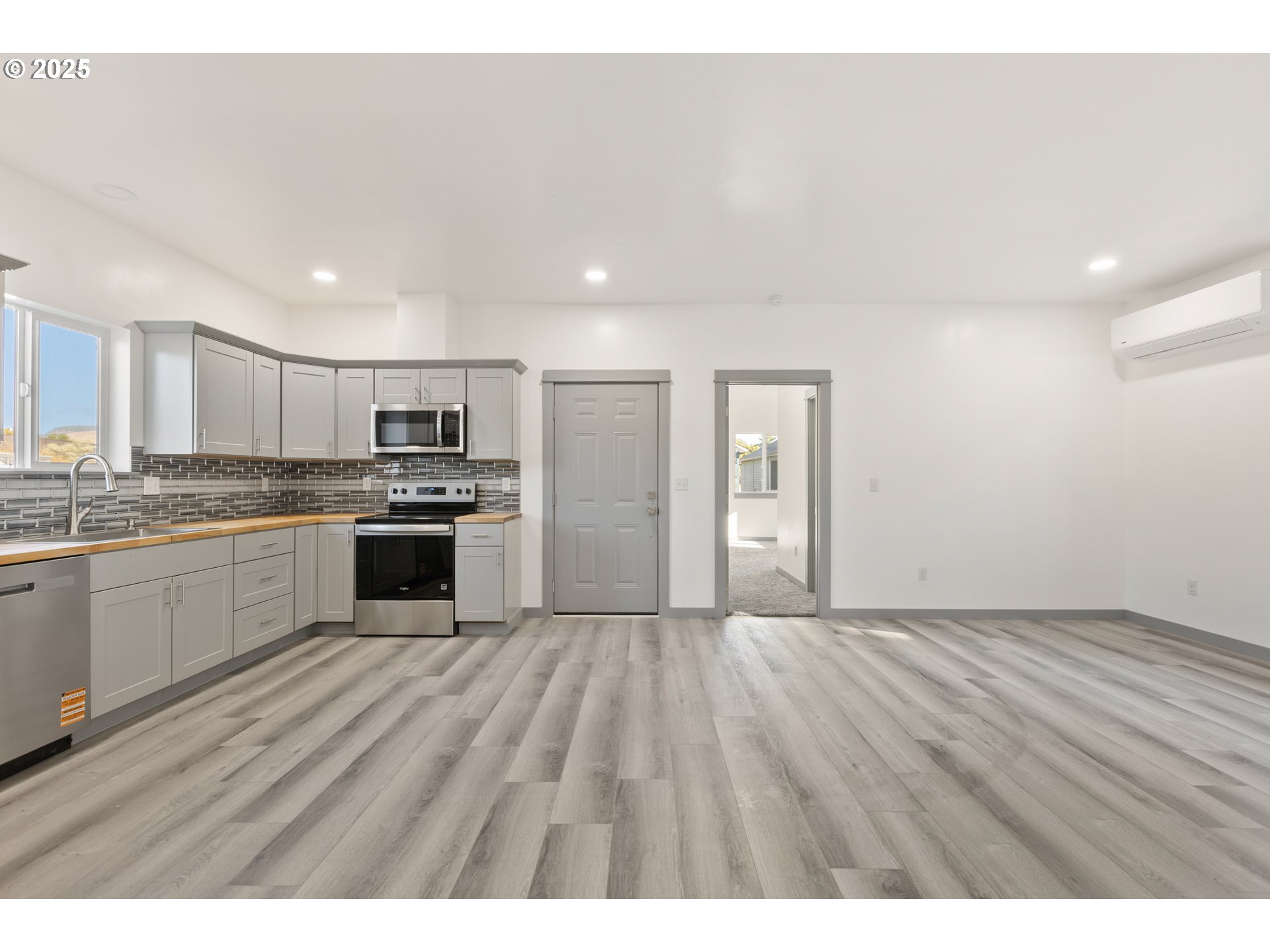 2104 True Avenue La Grande, OR 97850 - Photo 2 of 15 a view of kitchen with granite countertop cabinets and refrigerator
