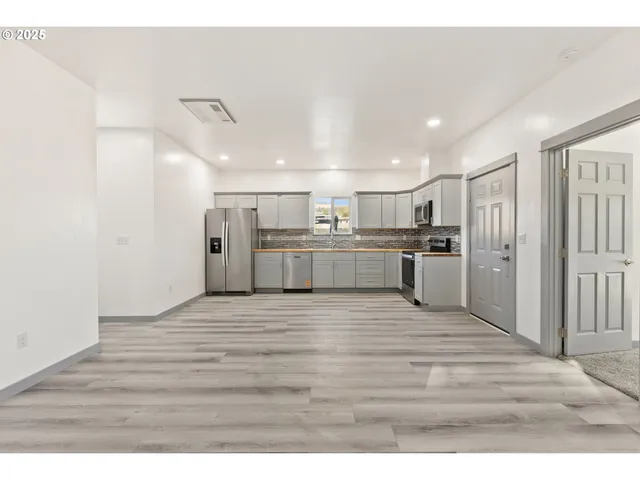 a view of kitchen with wooden floor
