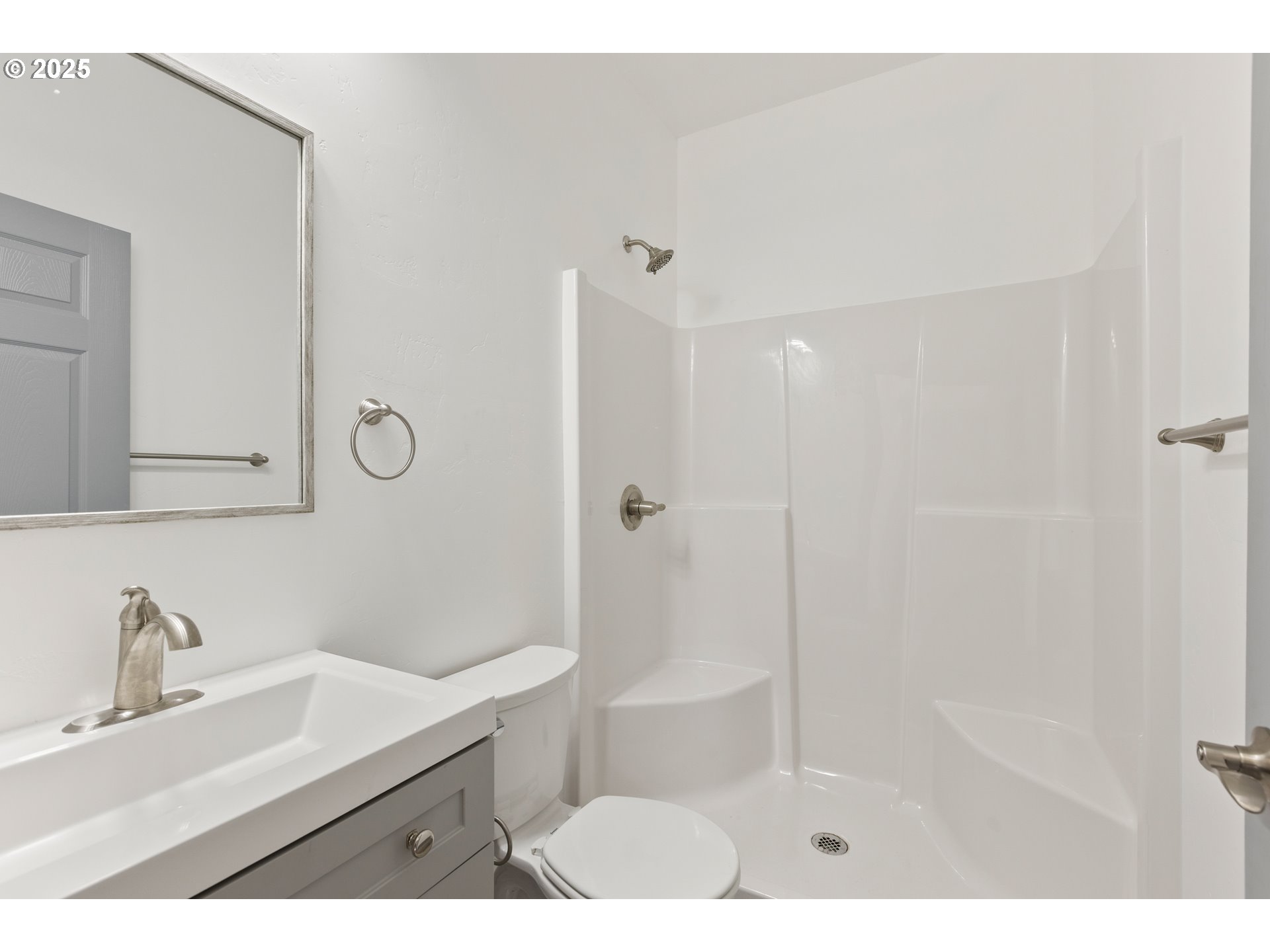 2104 True Avenue La Grande, OR 97850 - Photo 9 of 15 a bathroom with a sink mirror and shower