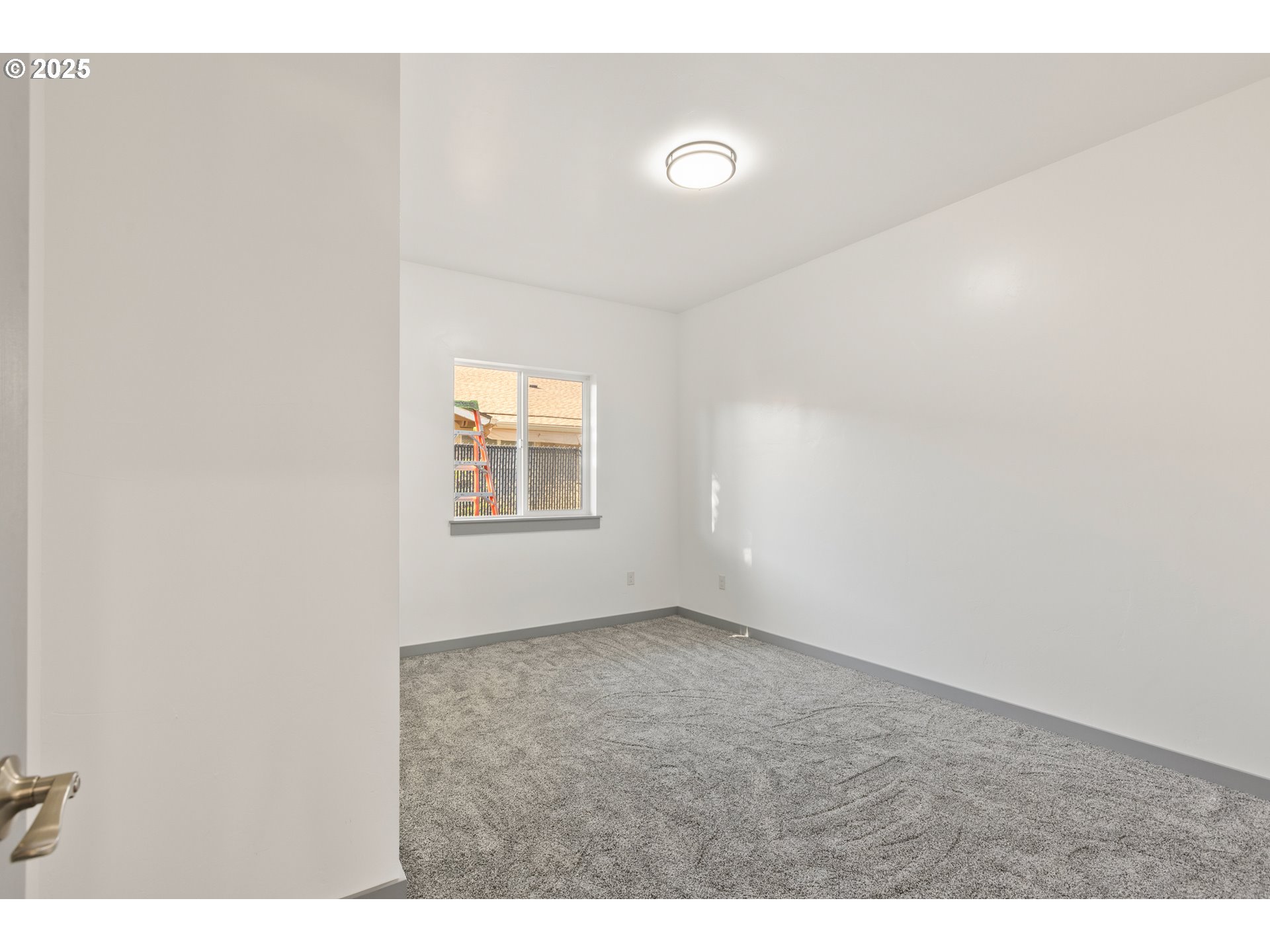 2104 True Avenue La Grande, OR 97850 - Photo 10 of 15 a view of an empty room with a window