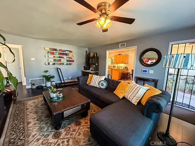 a kitchen with stainless steel appliances granite countertop a refrigerator and a stove