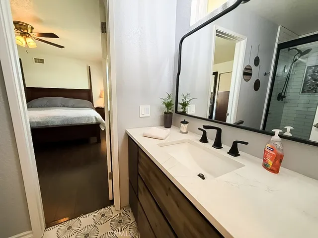a bathroom with a sink and a mirror